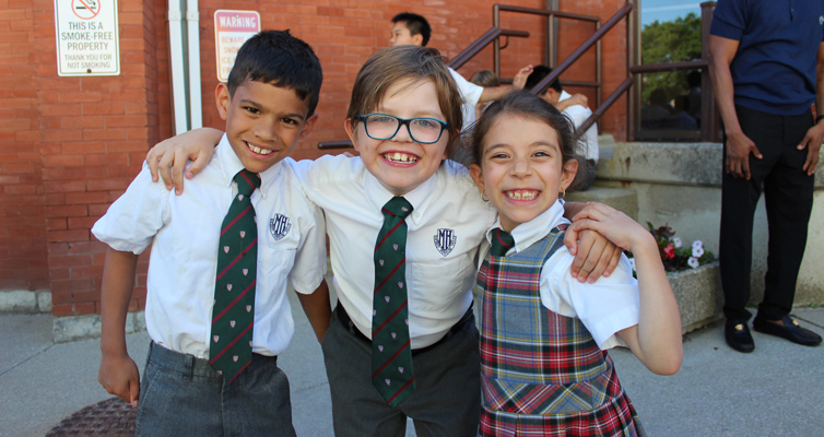 Young students posing for camera